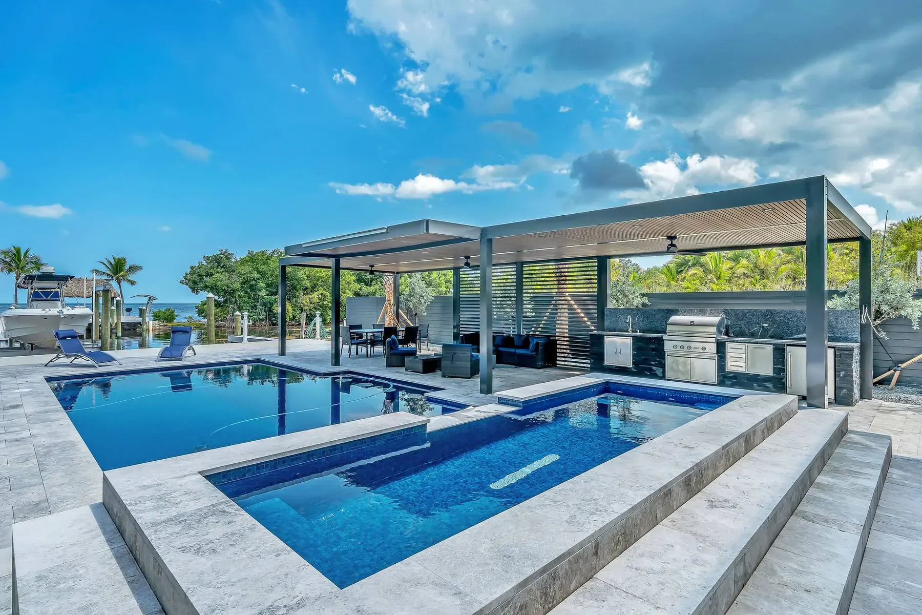 Key Largo waterfront pool and pergola designed by Blue By Cindy