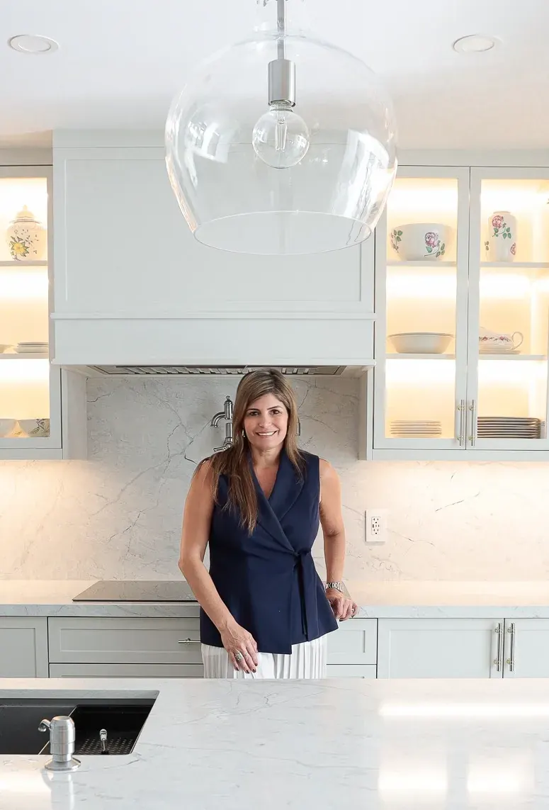Cindy Aviles, founder of Blue By Cindy, in a designed kitchen